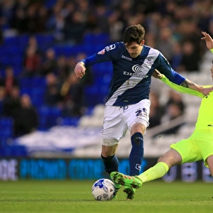 Intense Rivalry: Battle for the Ball between Birmingham City's Kyle Lafferty and Brighton & Hove Albion's Dale Stephens
