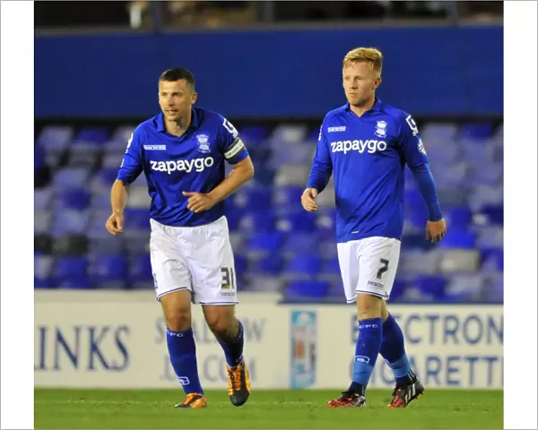 Double Trouble: Paul Caddis and Partner's Thrilling Double Strike in Birmingham City's Capital One Cup Upset over Cambridge United (St. Andrew's)