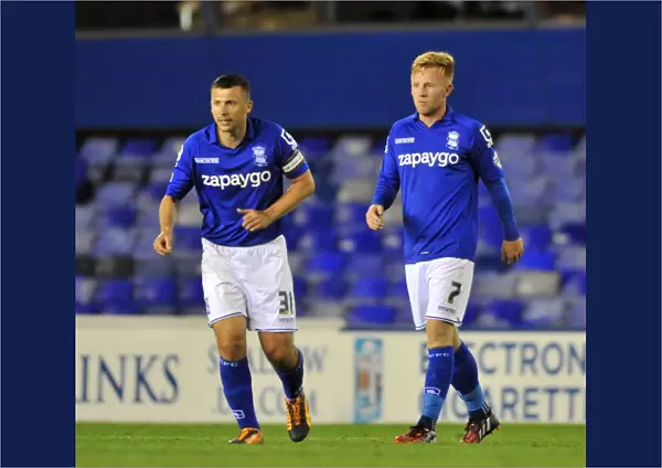 Double Trouble: Paul Caddis and Partner's Thrilling Double Strike in Birmingham City's Capital One Cup Upset over Cambridge United (St. Andrew's)