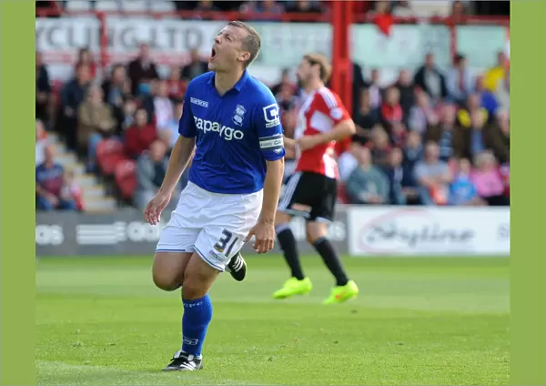 Paul Caddis Scores Birmingham City's Thrilling Penalty Goal: Sky Bet Championship's Exciting Opening Moment at Griffin Park