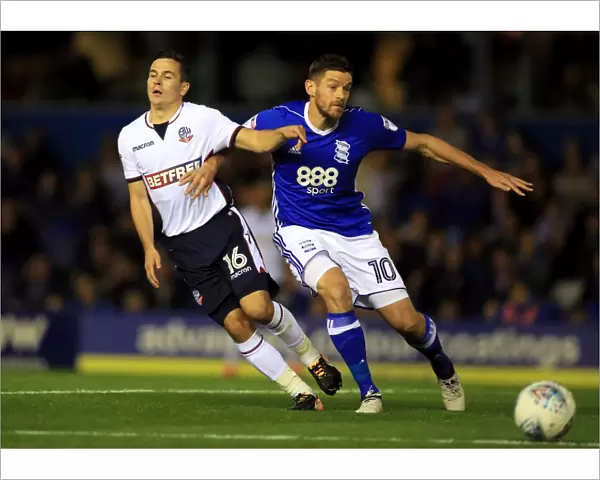 Birmingham City vs. Bolton Wanderers: Intense Battle for Possession between Lukas Jutkiewicz and Josh Cullen