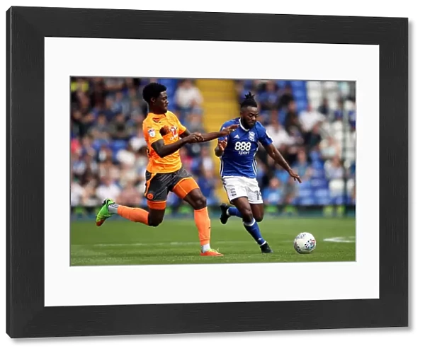 Birmingham City vs. Reading: Intense Battle for the Ball between Jacques Maghoma and Tyler Blackett