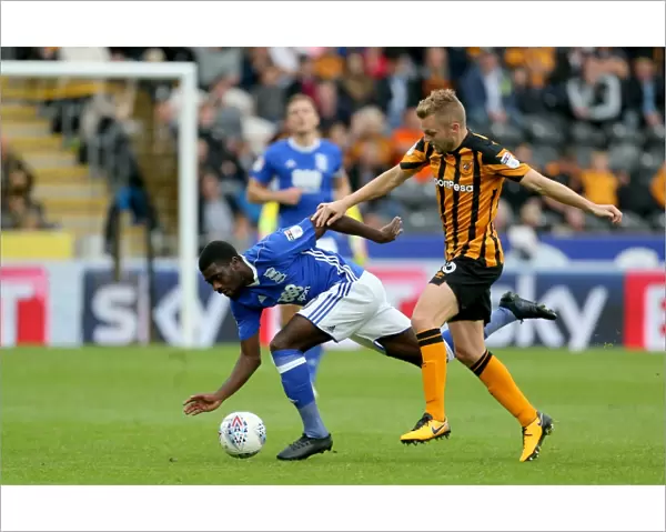 Hull City vs Birmingham City: Intense Battle for the Ball between Larsson and Boga at KCOM Stadium