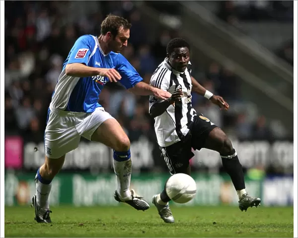 Intense Rivalry: Martins vs. Taylor's Battle for the Ball in FA Cup Third Round Replay between Newcastle United and Birmingham City (17-01-2007, St. James Park)