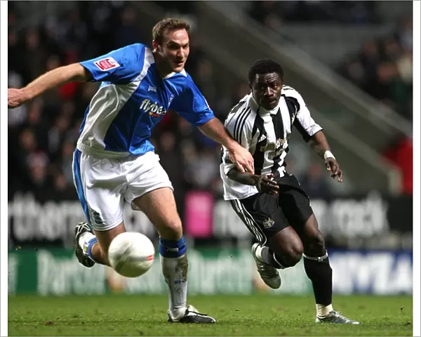 Martin vs. Martins: An Intense FA Cup Battle - Obafemi Martins of Newcastle United and Martin Taylor of Birmingham City Fight for Possession (January 17, 2007, St. James Park)
