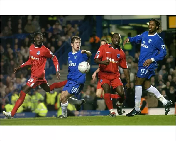 Drogba vs Tebily and Melchiot: A FA Cup Battle at Stamford Bridge (January 30, 2005) - Chelsea's Didier Drogba Clashes with Birmingham City's Olivier Tebily and Mario Melchiot