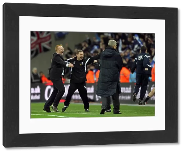Birmingham City manager Alex McLeish and his backroom staff celebrate at the final whistle