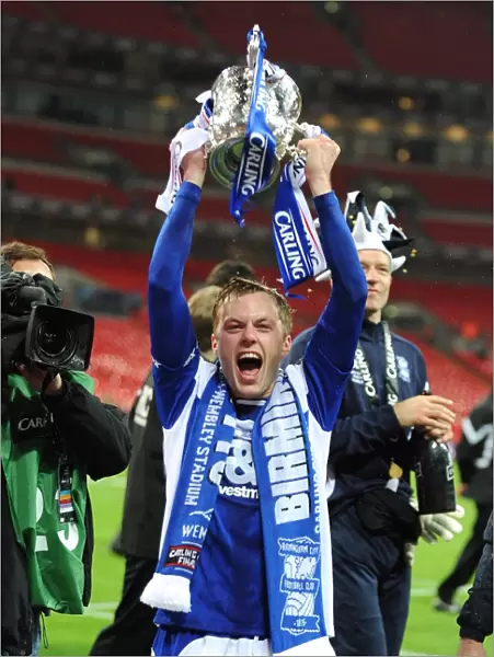 Birmingham City FC's Sebastian Larsson Triumphantly Holds the Carling Cup at Wembley Stadium