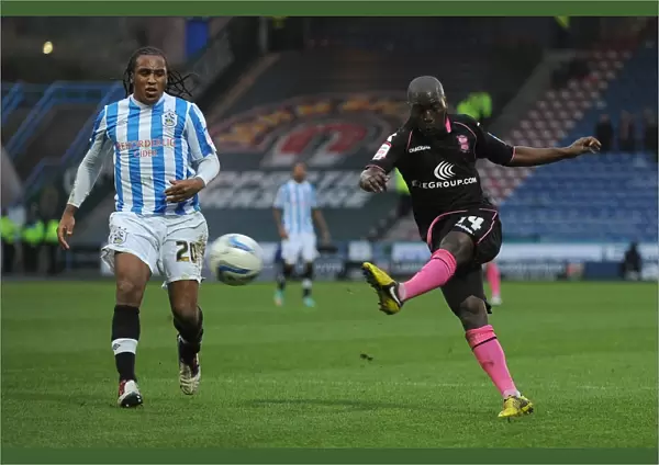 Morgaro Gomis's Determined Strike: Huddersfield vs. Birmingham City Championship Showdown at John Smith's Stadium