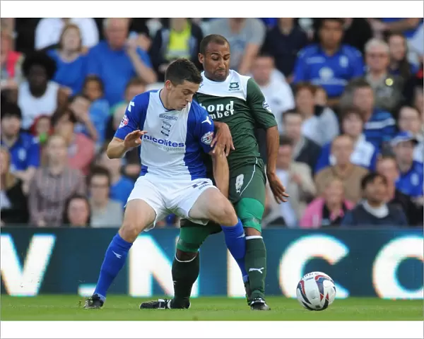 Intense Rivalry: Callum Reilly vs. Romuald Boco - Battle for the Ball (Birmingham City vs. Plymouth Argyle, Capital One Cup First Round)