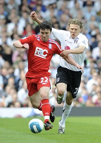 Battle for the Ball: Johnson vs. Bullard - A Premier League Showdown (Fulham vs. Birmingham City, 03-05-2008, Craven Cottage)