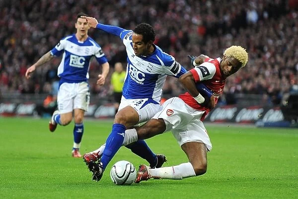 Battleground Wembley: Beausejour vs. Song - Carling Cup Final Showdown: Birmingham City's Jean Beausejour and Arsenal's Alex Song Clash in Intense Rivalry