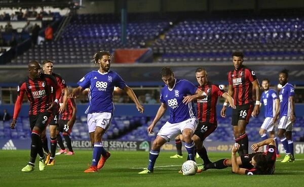 Battling for the Ball: Jutkiewicz vs. Pugh in the Carabao Cup Second Round Clash between Birmingham City and AFC Bournemouth