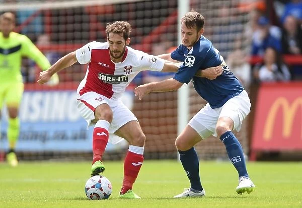 Battling for the Ball: A Tight Tussle Between Reece Styche and Jonathan Grounds in Birmingham City's Pre-Season Clash with Kidderminster Harriers