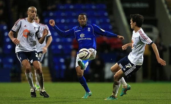 Battling for Control: Pratley vs. Hall in the Npower Championship Showdown between Birmingham City and Bolton Wanderers (December 2012)