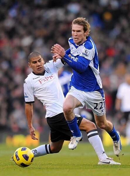 Battling for Control: Salcido vs. Hleb - A Premier League Showdown between Fulham and Birmingham City (November 2010)