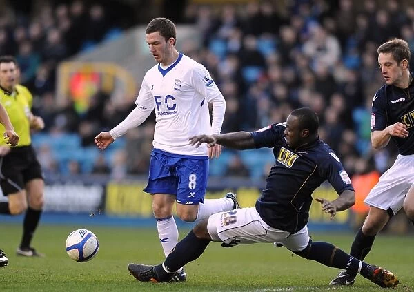 Battling for FA Cup Glory: A Clash Between Shittu and Gardner at The New Den (Millwall vs. Birmingham City, 2011)