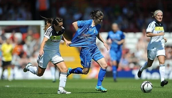 Battling for the FA Cup: A Riveting Moment between Karen Carney and Claire Rafferty of Birmingham City Ladies and Chelsea Ladies