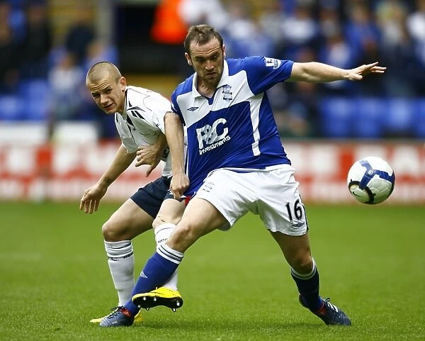 Battling for Supremacy: McFadden vs. Weiss in the Barclays Premier League Clash between Birmingham City and Bolton Wanderers (09-05-2010, Reebok Stadium)