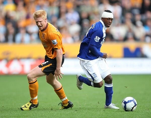 Benitez Evasive: Birmingham City's Christian Escapes McShane's Grasp (September 19, 2009, Barclays Premier League, KC Stadium)