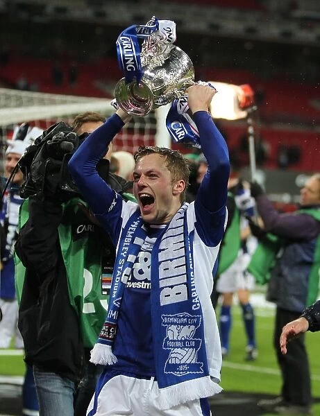 Birmingham City FC's Sebastian Larsson Triumphs in the Carling Cup Final at Wembley: Holding the Trophy