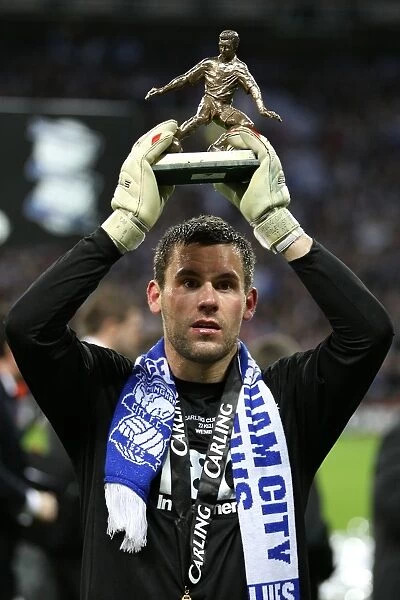 Birmingham City goalkeeper Ben Foster celebrates with his man of the match trophy