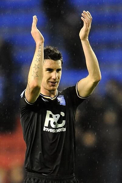 Birmingham City's Liam Ridgewell: Celebrating Promotion to Premier League after Win against Wigan Athletic (05-12-2009)