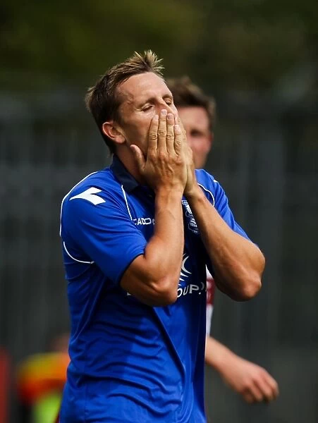 Birmingham City's Lovenkrands Disappointed by Missed Goal Opportunity Against Cheltenham Town (Pre-Season Friendly)