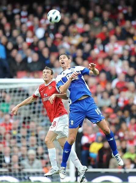 Birmingham City's Nikola Zigic Outmuscles Arsenal's Sebastien Squillaci in Intense Barclays Premier League Battle (October 16, 2010, Emirates Stadium)