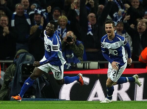 Birmingham Citys Obafemi Martins (left) celebrates scoring the winning goal