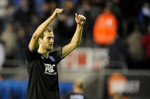 Birmingham City's Roger Johnson: Celebrating Promotion to Premier League after Win against Wigan Athletic (05-12-2009)