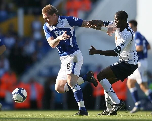 Birmingham vs. Bolton: A Premier League Showdown - Garry O'Connor vs. Fabrice Muamba's Intense Battle for Ball Supremacy (September 2009)