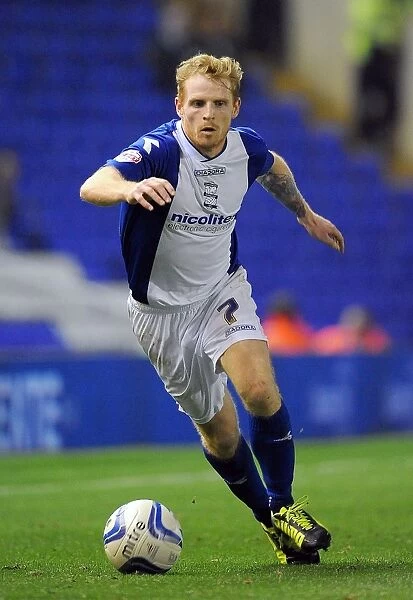Chris Burke vs Millwall: Intense Face-Off in Birmingham City's Sky Bet Championship Match at St. Andrew's (1st October 2013)