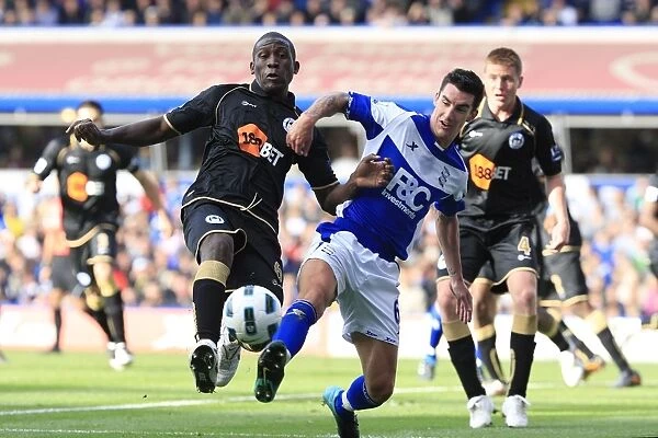 Clash of Titans: Thomas vs. Ridgewell in the Premier League Showdown between Birmingham City and Wigan Athletic (September 25, 2010, St. Andrew's)