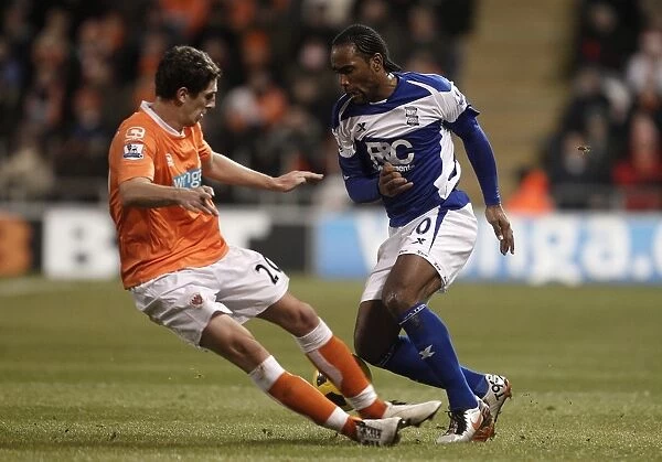 Dodging Defender: Cameron Jerome Evasively Avoids Craig Cathcart's Tackle (Birmingham City vs Blackpool, Barclays Premier League, 04-01-2011)