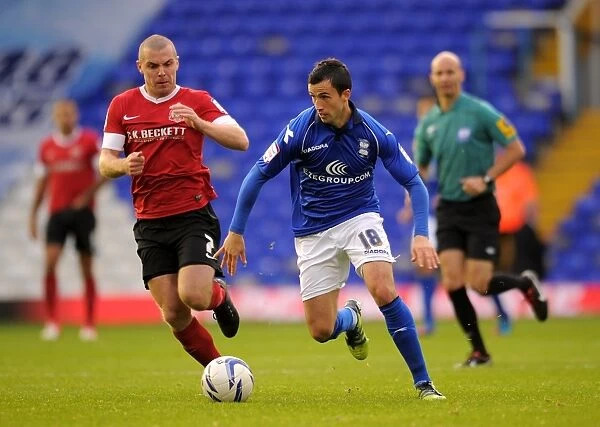 Fahey vs Dawson: Intense Clash Between Birmingham City's Keith Fahey and Barnsley's Stephen Dawson in Championship Match at St. Andrew's