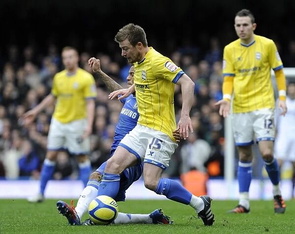 Fifth Round FA Cup Clash: Wade Elliott vs. Ryan Bertrand - Intense Battle at Stamford Bridge (2012)
