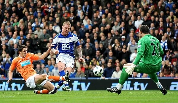 Garry O'Connor's Early Goal Attempt under Intense Defensive Pressure: Birmingham City vs. Blackpool (Barclays Premier League)