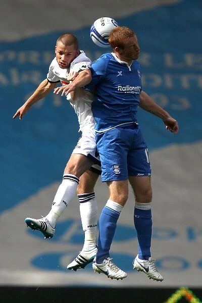 Intense Aerial Clash: Dunne vs. Rooney in Birmingham City vs. Millwall (Npower Championship, September 11, 2011)