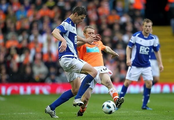 Intense Battle for the Ball: Ormerod vs. Zigic - Premier League Showdown (Birmingham City vs. Blackpool, 2010)