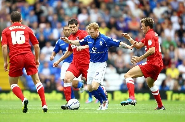 Intense Championship Showdown: Birmingham City vs Charlton Athletic - Burke vs Stephens and Hollands Battle for Ball Control (18-08-2012)