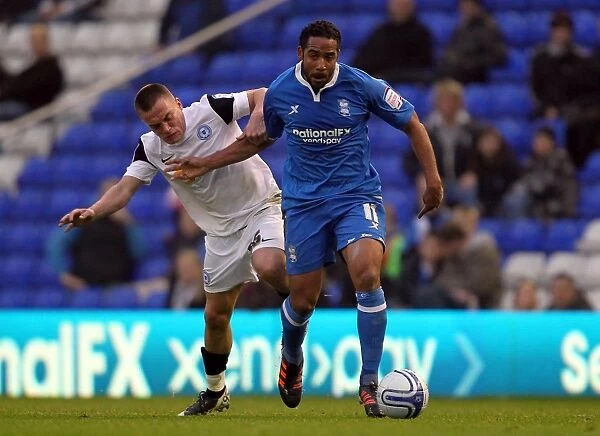 Intense Rivalry: Beausejour vs. Taylor Battle for Control in Birmingham City vs. Peterborough United (Npower Championship, 19-11-2011)