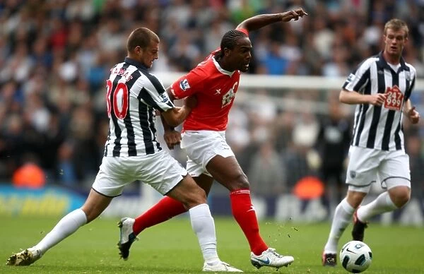 Intense Rivalry: Birmingham City vs. West Bromwich Albion - A Battle for Ball Possession at The Hawthorns (Premier League, 18-09-2010)