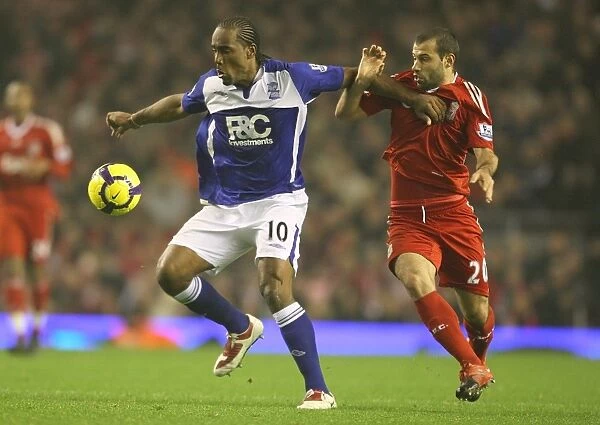 Intense Rivalry: Jerome vs Mascherano's Battle for Ball Possession (Birmingham City vs Liverpool, Barclays Premier League, 09-11-2009, Anfield)