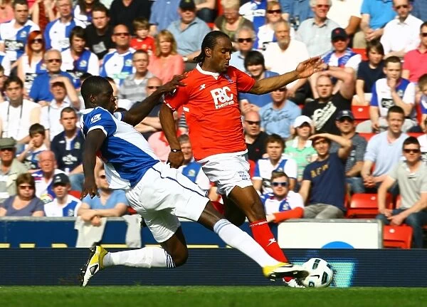 Intense Rivalry: Jerome vs. Samba's Battle for Ball Possession (Birmingham City vs. Blackburn Rovers, Premier League, 09-04-2011, Ewood Park)