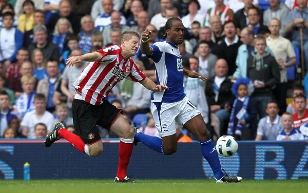 Intense Rivalry: Jerome vs. Turner's Battle for Ball Possession (BPL, Birmingham City vs. Sunderland, 16-04-2011)