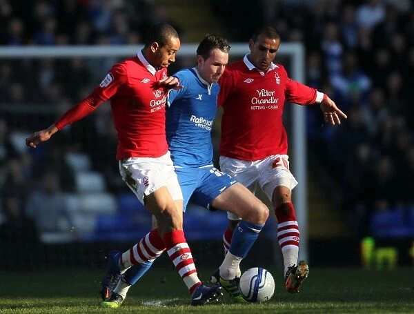 Intense Rivalry: Jordan Mutch vs. Dexter Blackstock and Marcus Tudgay - A Battle for Control in Birmingham City vs. Nottingham Forest (Npower Championship, 25-02-2012, St. Andrew's)