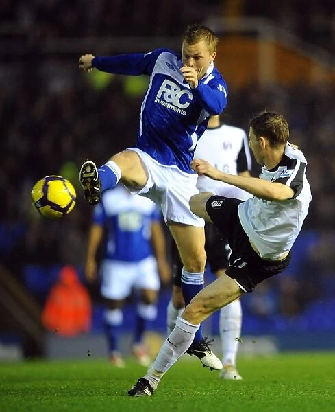Intense Rivalry: Larsson vs. Gera - Battle for Ball Possession (Birmingham City vs. Fulham, Premier League, 2009)