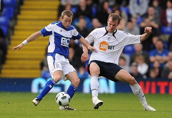 Intense Rivalry: Lee Bowyer vs. David Wheater Battle for the Ball (BPL, 2011)