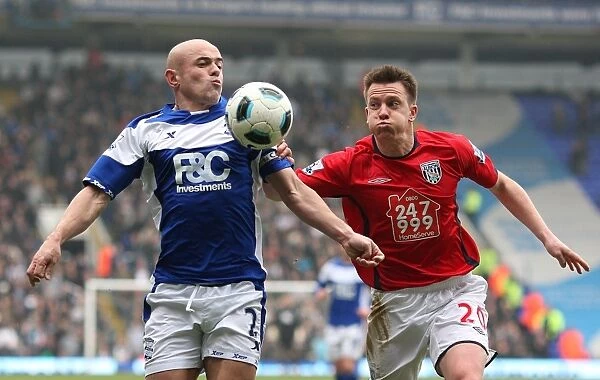 Intense Rivalry: Shorey vs. Carr Battle for Ball - Birmingham City vs. Newcastle United (BPL, 2011)